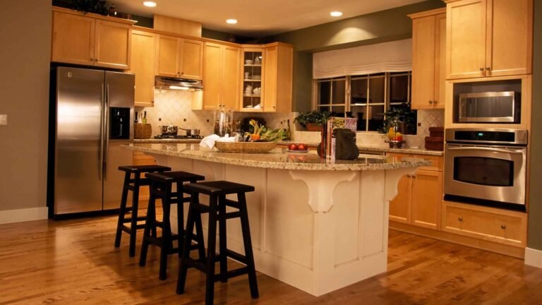 Newly remodeled kitchen with custom oak cabinetry, island and lighting